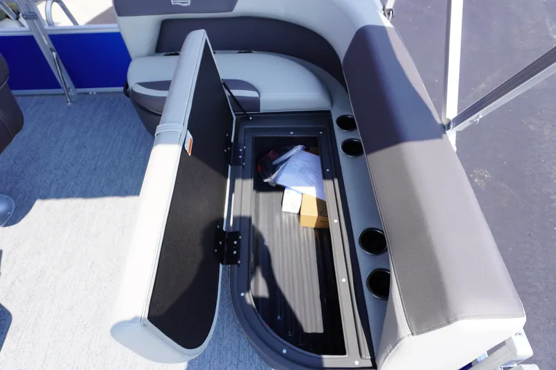 Slide: The Image of 2027 Sun Tracker Bass Buggy 16 DLX boat seat storage compartment open. - 11