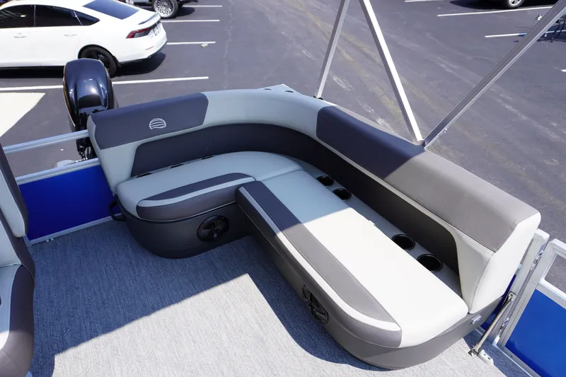 Slide: The Image of 2027 Sun Tracker Bass Buggy 16 DLX pontoon boat interior with cushioned seating. - 8