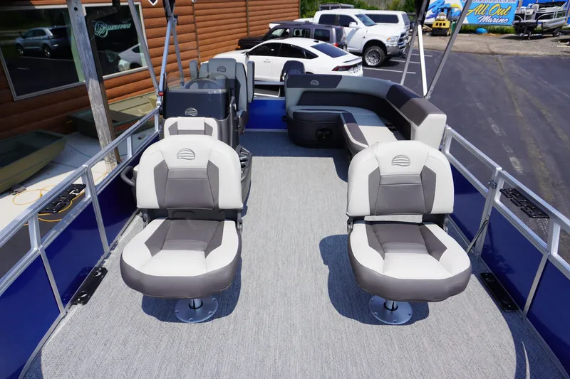 Slide: The Image of 2027 Sun Tracker Bass Buggy 16 DLX pontoon boat interior with plush seating and modern design. - 5