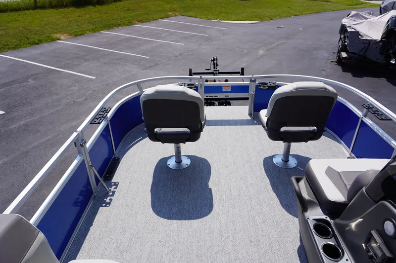 Slide: The Image of 2027 Sun Tracker Bass Buggy 16 DLX pontoon boat interior with seating and steering console. - 13