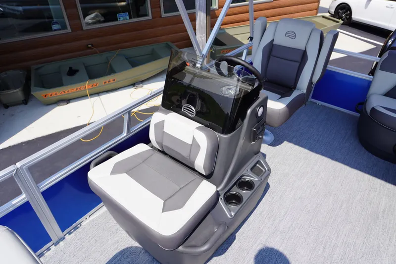 Slide: The Image of 2027 Sun Tracker Bass Buggy 16 DLX interior with modern seating and console design. - 6