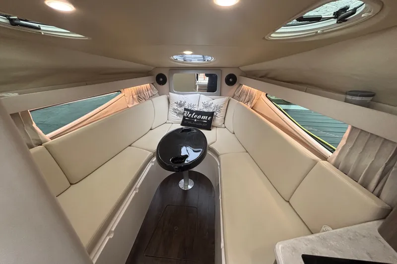 Slide: The Image of Luxurious interior of 2019 Regal 28 Express boat with cozy seating and elegant decor. - 27