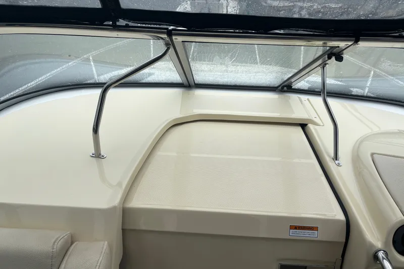 Slide: The Image of 2019 Regal 28 Express boat interior with windshield and dashboard details. - 26