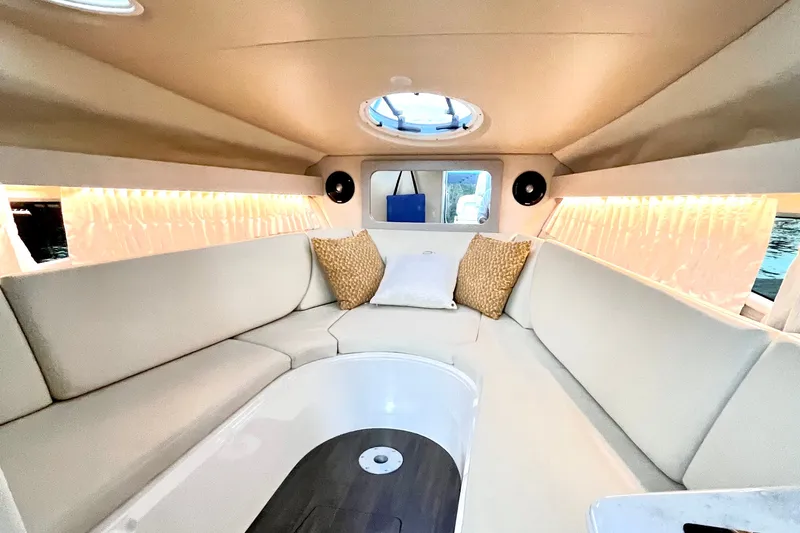 Slide: The Image of Luxurious interior of 2019 Regal 28 Express boat with plush seating and ambient lighting. - 7
