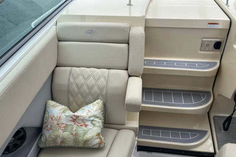 Slide: The Image of Luxurious interior of 2019 Regal 28 Express boat with plush seating and decorative pillow. - 24