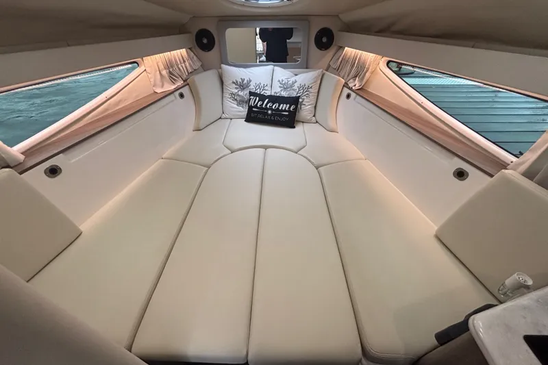 Slide: The Image of Interior cabin of 2019 Regal 28 Express boat with cozy seating and welcome pillows. - 42