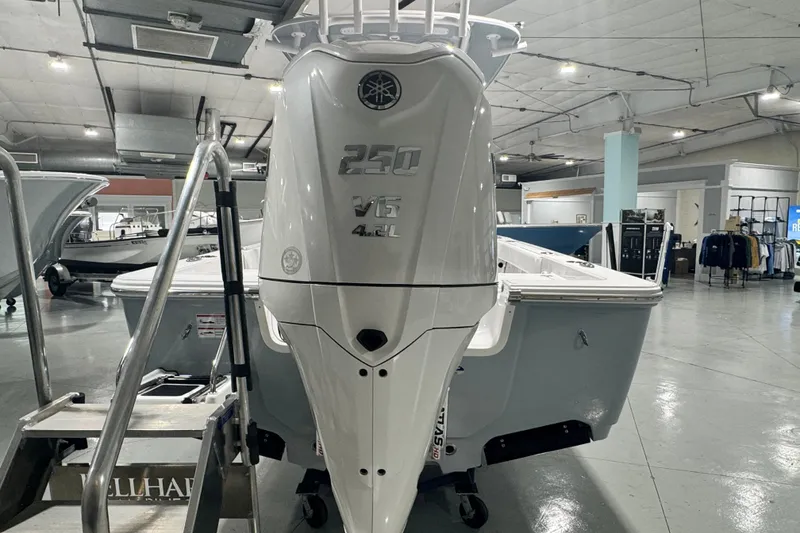 Slide: The Image of 2027 Sportsman Masters 227 Bay Boat with powerful 250 V6 engine in showroom. - 8