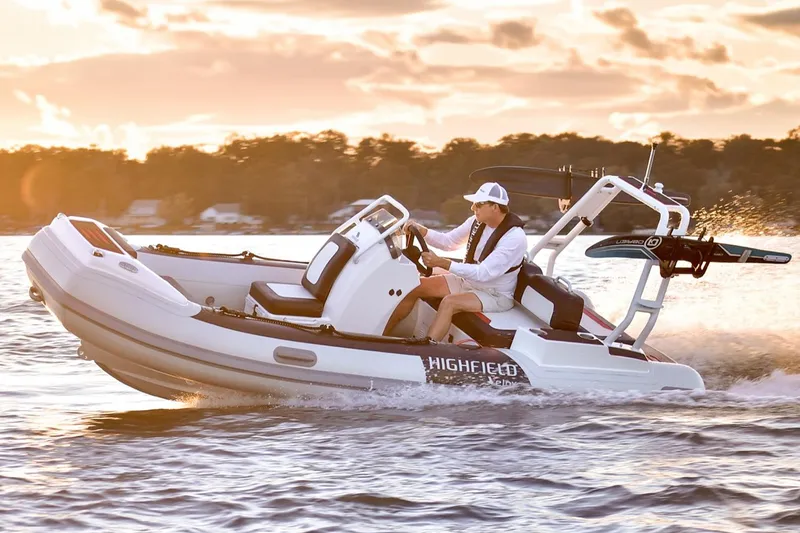 Slide: The Image of Manufacturer Provided Image: 2025 Highfield Velox 420 boat cruising on water at sunset. - 17