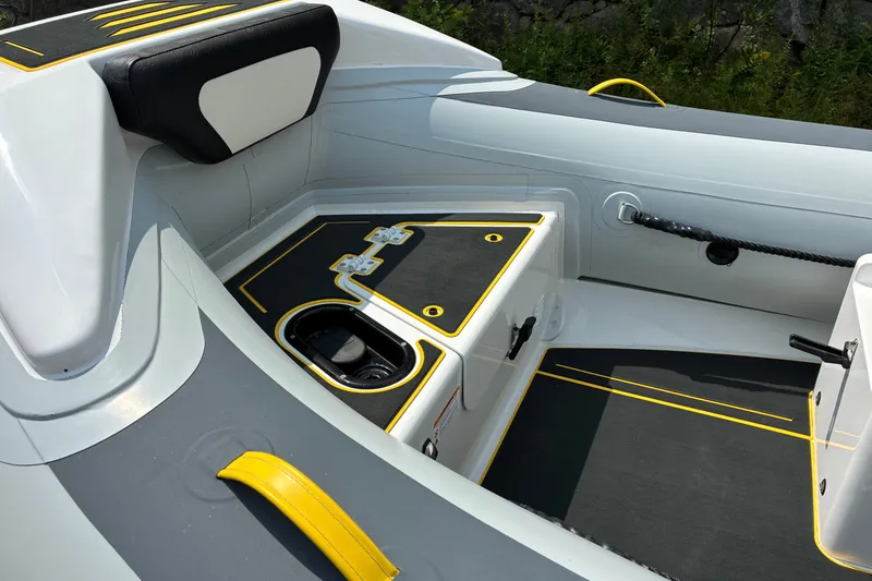 Slide: The Image of Interior of 2026 Highfield Velox 420 boat, featuring sleek seating and storage compartments. - 13
