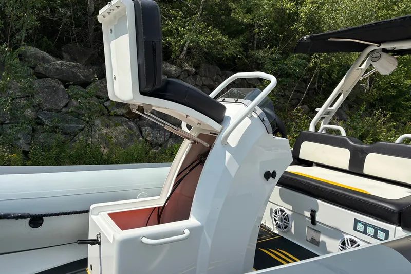 Slide: The Image of 2026 Highfield Velox 420 boat interior with open storage compartment and seating. - 6