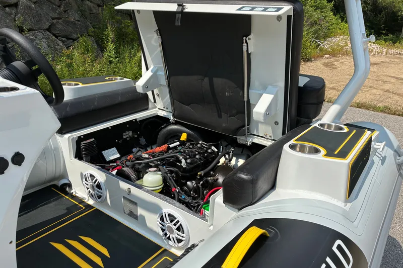 Slide: The Image of 2026 Highfield Velox 420 boat engine compartment with open hatch, showcasing internal components. - 15