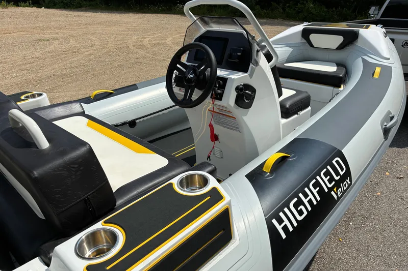 Slide: The Image of 2026 Highfield Velox 420 inflatable boat interior with steering console and seating. - 7