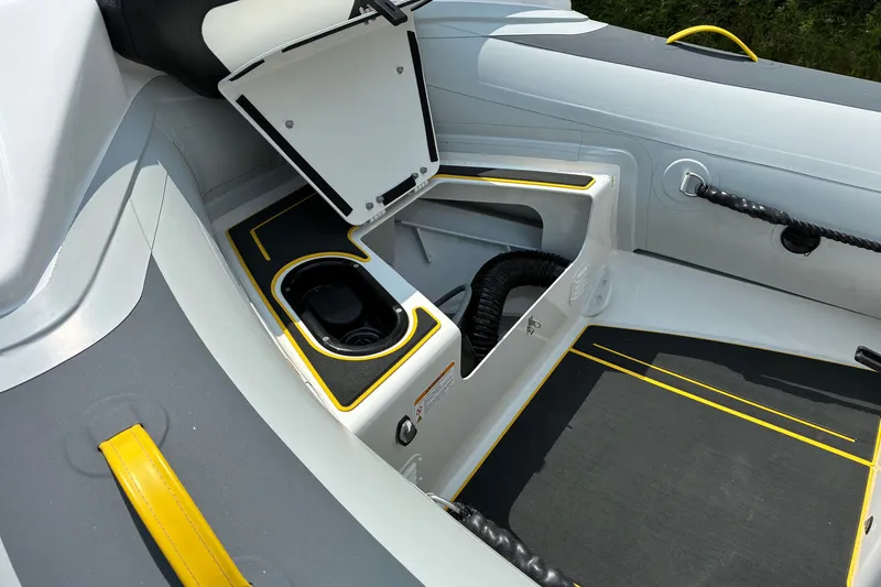 Slide: The Image of 2026 Highfield Velox 420 boat interior with open storage compartment and sleek design. - 14