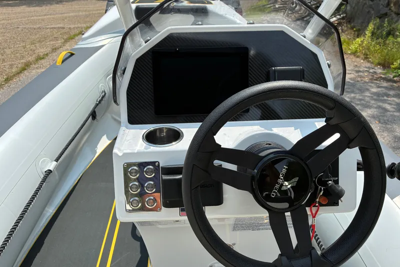 Slide: The Image of Steering console of 2026 Highfield Velox 420 boat with modern controls and dashboard. - 9