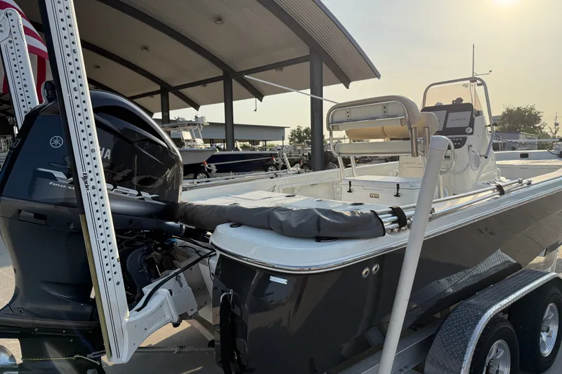 Slide: The Image of 2018 NauticStar 244 XTS boat with Yamaha engine on trailer, under covered dock. - 11