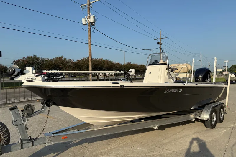 Slide: The Image of 2018 NauticStar 244 XTS boat on trailer, featuring Minn Kota trolling motor. - 5