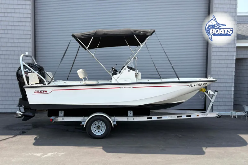 The Image of 2018 Boston Whaler 170 Montauk boat on trailer, parked outdoors. - 0