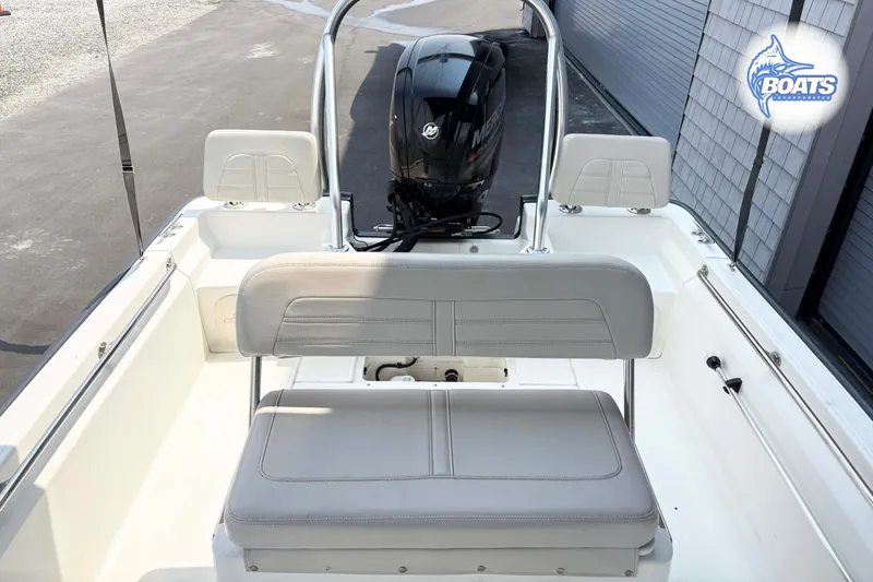 Slide: The Image of 2018 Boston Whaler 170 Montauk boat interior with seating and Mercury engine. - 9