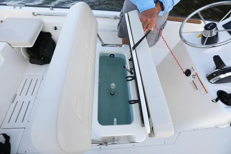 Slide: The Image of Manufacturer Provided Image: 2018 Boston Whaler 170 Montauk boat interior with livewell and seating. - 10