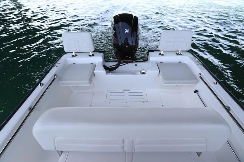 Slide: The Image of Manufacturer Provided Image: 2018 Boston Whaler 170 Montauk boat interior with seating and outboard motor. - 11