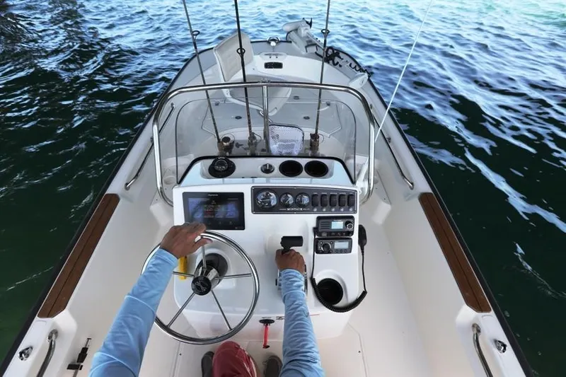 Slide: The Image of Manufacturer Provided Image: 2018 Boston Whaler 170 Montauk boat console with steering wheel and controls. - 6