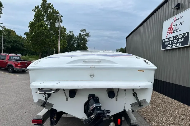 Slide: The Image of 1999 Baja 29 Outlaw boat at Premier Advantage Marine dealership. - 2