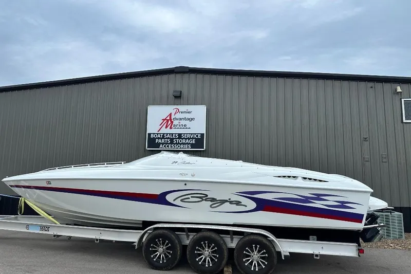 The Image of 1999 Baja 29 Outlaw boat on trailer at Premier Advantage Marine. - 0