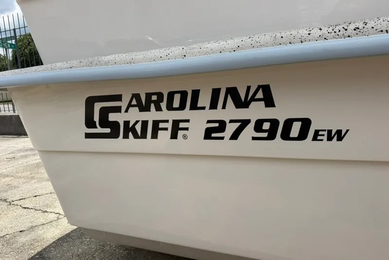 Slide: The Image of Carolina Skiff 2790 boat, model year 2027, side view with logo. - 1