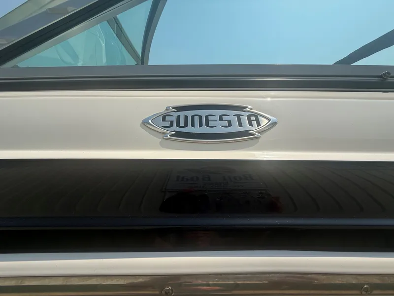 Slide: The Image of Close-up of the "Sunesta" logo on a white boat. - 7
