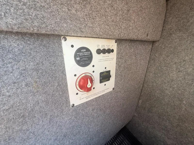 Slide: The Image of An electrical panel with switches and a red rotary switch is set into a gray wall. - 29