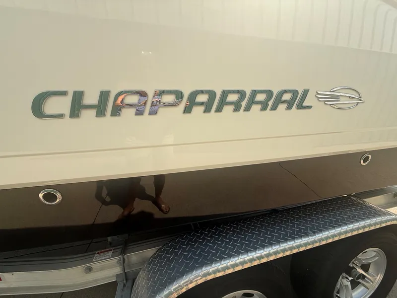 Slide: The Image of Close-up of the Chaparral 244 Sunesta logo on a boat trailer. - 6