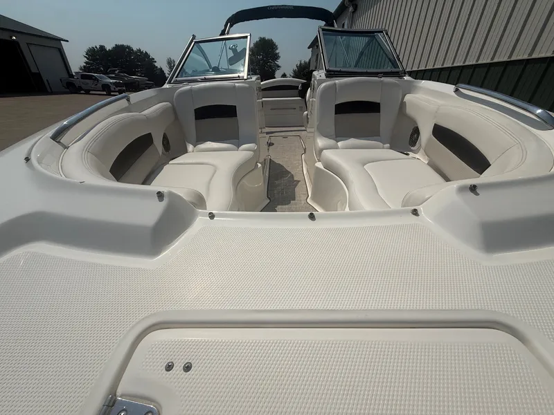Slide: The Image of The image shows the cockpit of a 2011 Chaparral 244 Sunesta boat with white seating. - 5