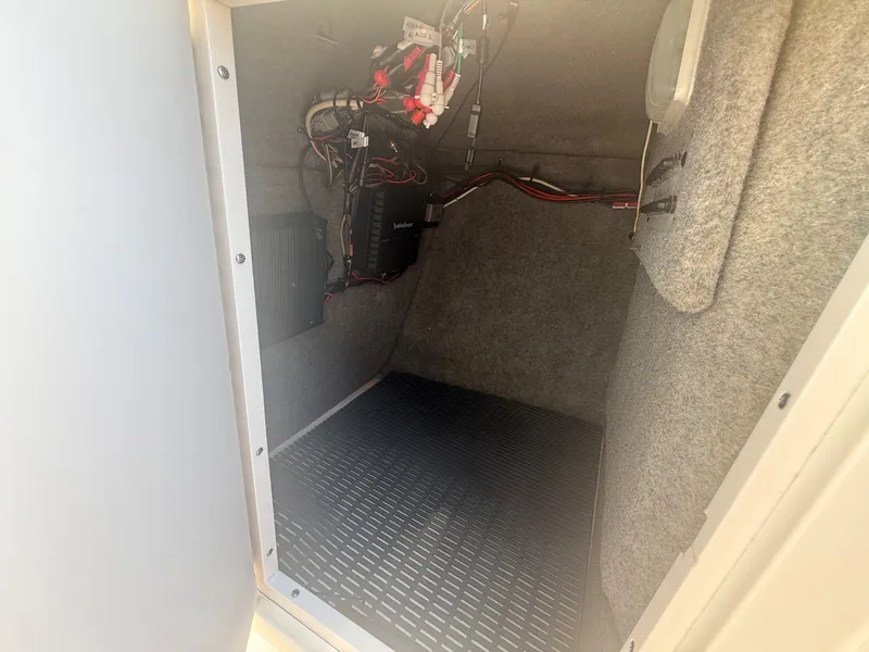 Slide: The Image of An interior space of a boat with electrical connections and wiring on the wall. - 23