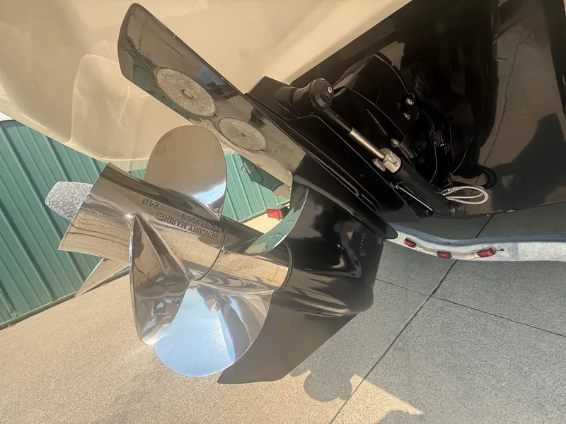 Slide: The Image of Close-up of a shiny propeller on a 2011 Chaparral 244 Sunesta boat. - 10