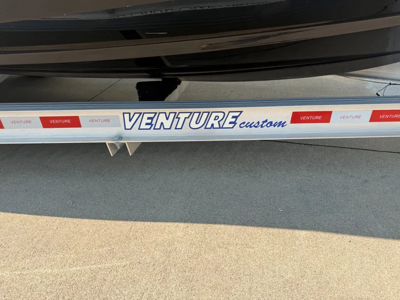 Slide: The Image of A 2011 Chaparral 244 Sunesta on a Venture Custom trailer. - 36
