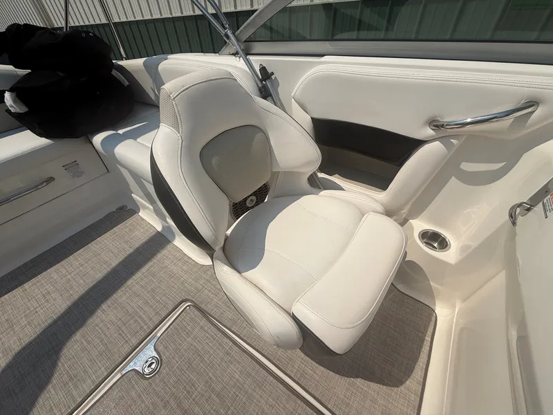 Slide: The Image of A luxurious white seat in a Chaparral 244 Sunesta boat, surrounded by sleek details. - 18
