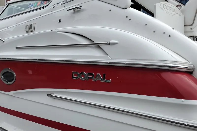 Slide: The Image of 2006 Doral Monticello 250 boat with red and white exterior detailing. - 9