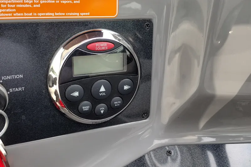 Slide: The Image of Control panel of a 2006 Doral Monticello 250 boat with audio system buttons. - 40