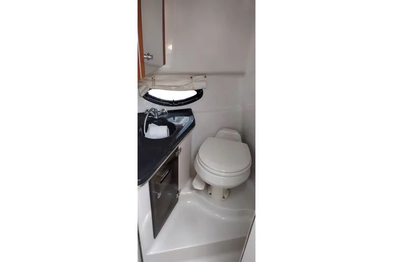 Slide: The Image of 2006 Doral Monticello 250 boat bathroom with sink and toilet. - 34