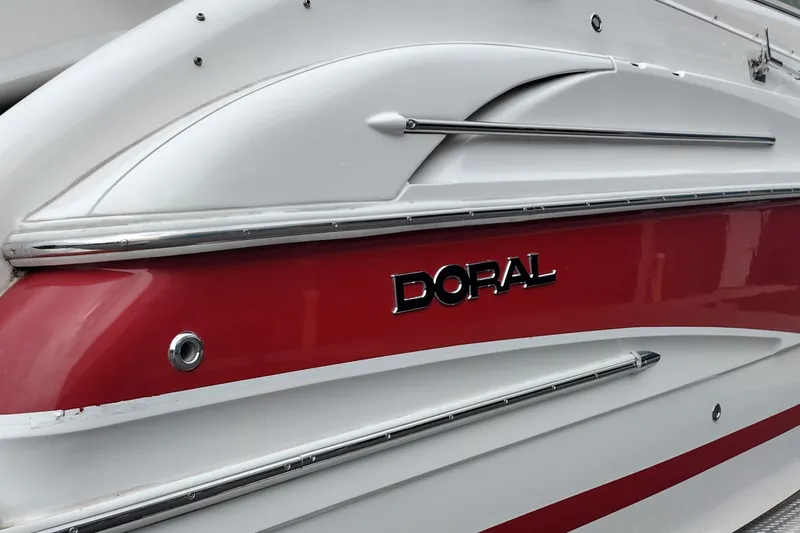 Slide: The Image of 2006 Doral Monticello 250 boat with red and white exterior detailing. - 10