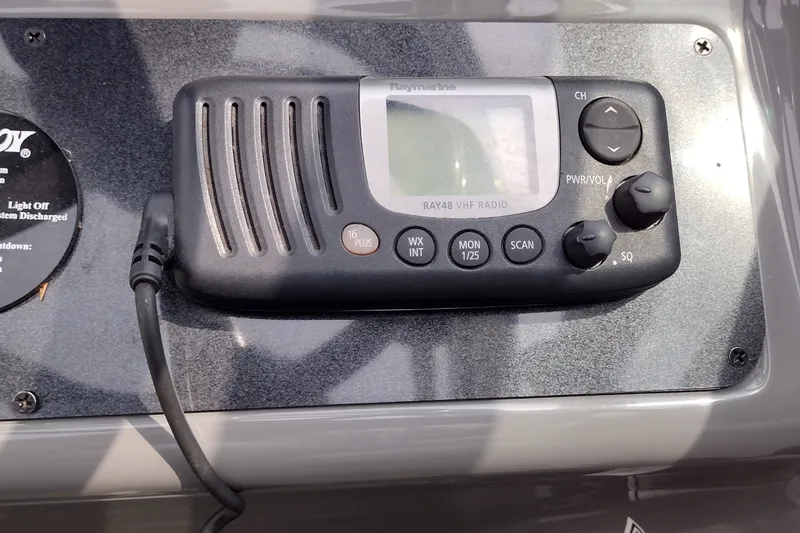 Slide: The Image of Raymarine RAY48 VHF radio on 2006 Doral Monticello 250 boat dashboard. - 41
