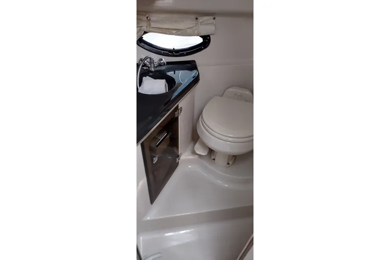 Slide: The Image of 2006 Doral Monticello 250 boat bathroom with sink and toilet. - 36