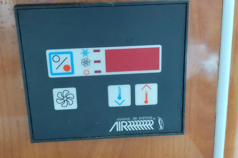 Slide: The Image of Control panel of a 2006 Doral Monticello 250 boat, featuring Marine Air Systems interface. - 32