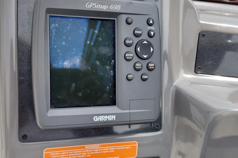 Slide: The Image of Garmin GPSmap 498 on 2006 Doral Monticello 250 boat dashboard. - 39