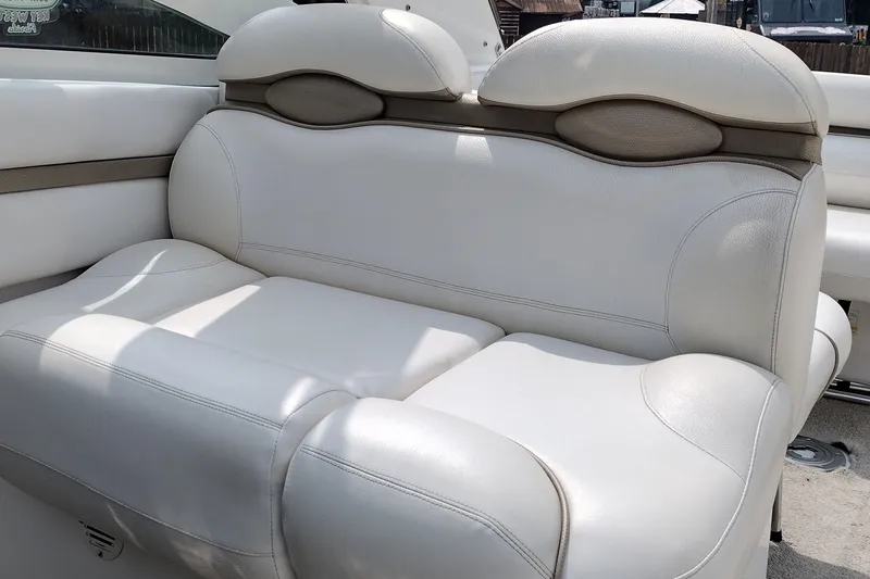 Slide: The Image of Luxurious white leather seating on a 2006 Doral Monticello 250 boat. - 38