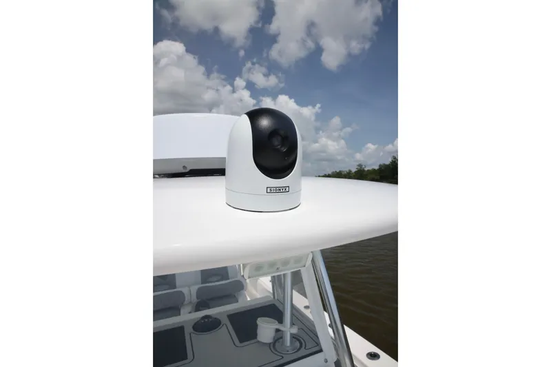 Slide: The Image of 2016 Contender 35 ST boat with mounted SiOnyx camera under a cloudy sky. - 25