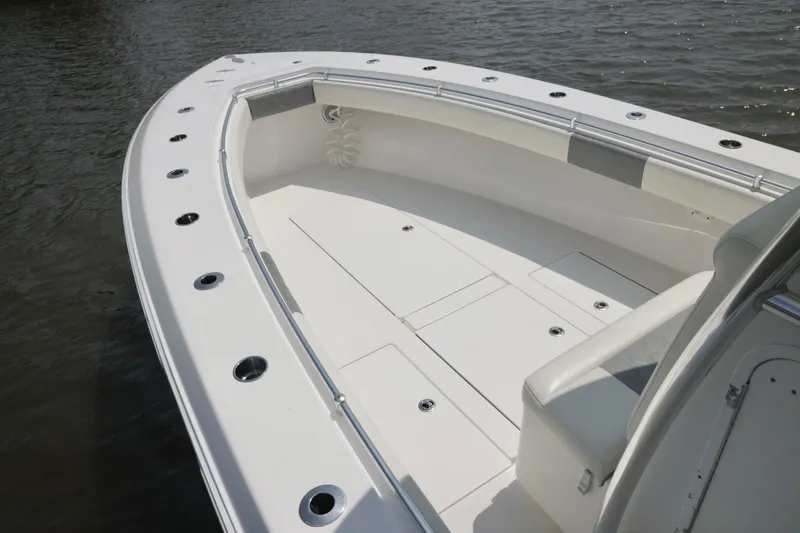 Slide: The Image of 2016 Contender 35 ST boat deck with sleek design and spacious seating on water. - 23