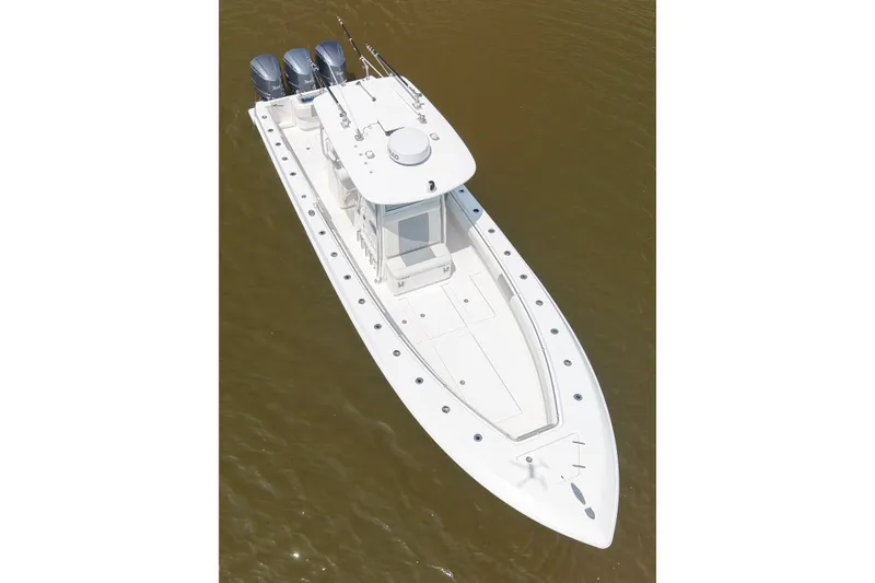 Slide: The Image of 2016 Contender 35 ST boat with triple outboard engines on calm water. - 9