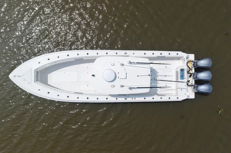 Slide: The Image of Aerial view of 2016 Contender 35 ST boat with triple engines on water. - 7
