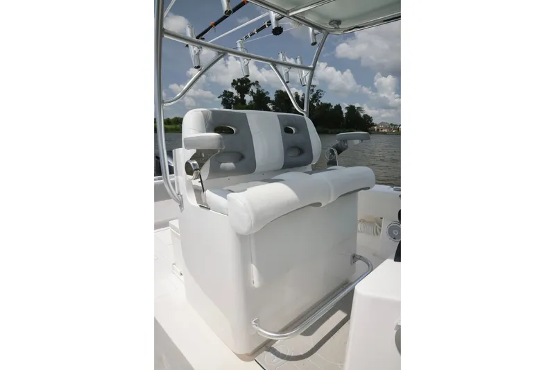 Slide: The Image of 2016 Contender 35 ST boat seating with rod holders, under a clear sky. - 19